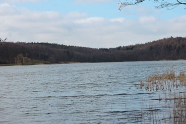 Bagsværd Lake with hills in the background and cloudy skies