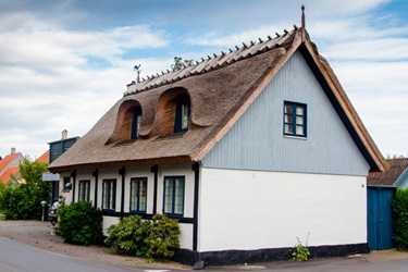 Viby an old well kept house with a thatched roof 
